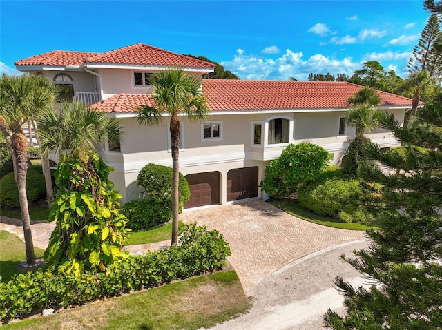 mediterranean / spanish house featuring a garage