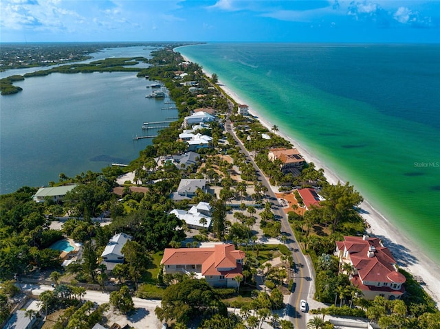 bird's eye view with a water view and a view of the beach