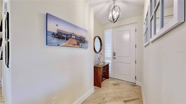 entryway featuring a chandelier