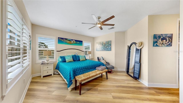 bedroom with ceiling fan and light wood-type flooring