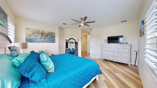 bedroom with light wood-type flooring and ceiling fan