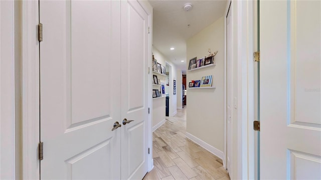 hallway with light wood-type flooring