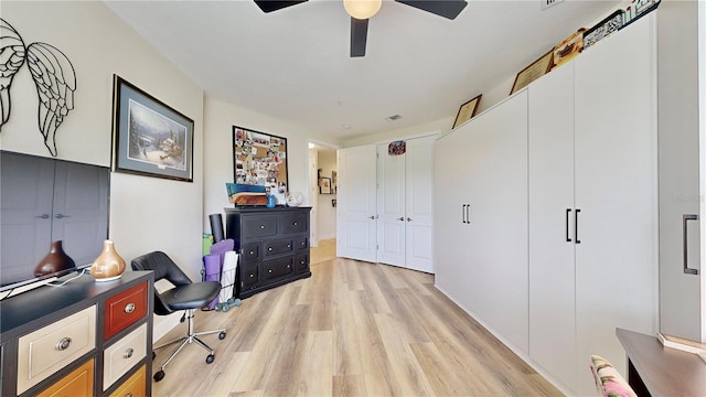 office area with ceiling fan and light hardwood / wood-style flooring