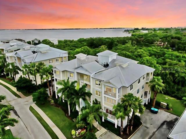 aerial view at dusk with a water view