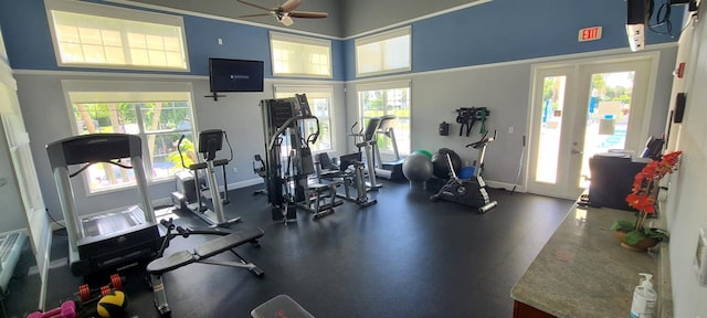 exercise room featuring ceiling fan, plenty of natural light, and french doors