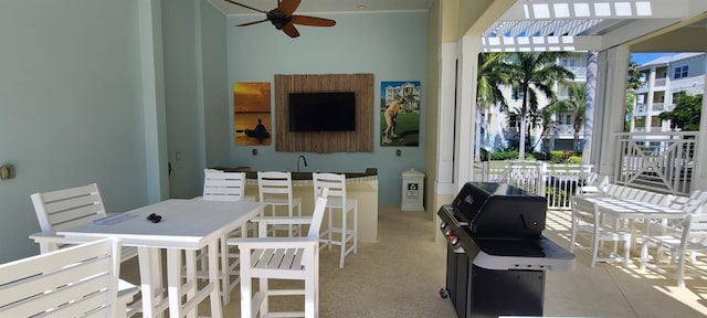 carpeted dining space featuring ceiling fan