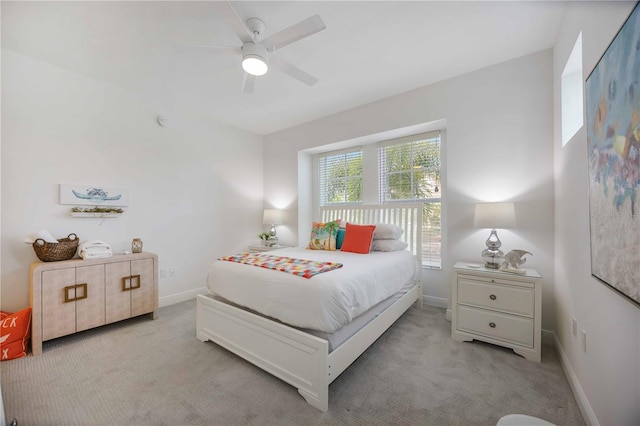 bedroom featuring ceiling fan and light colored carpet