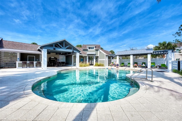 view of swimming pool featuring a pergola and a patio area