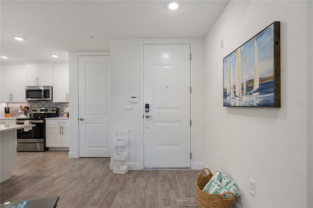 foyer entrance featuring light wood-type flooring