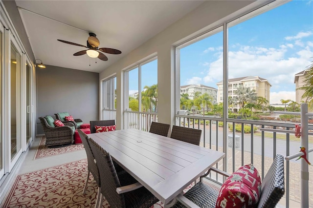 sunroom / solarium with ceiling fan