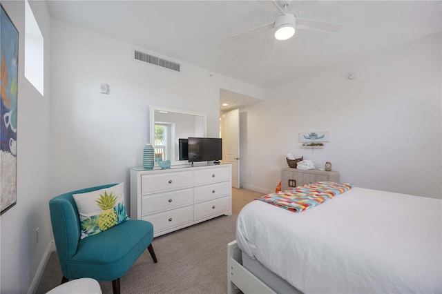 bedroom featuring light carpet and ceiling fan