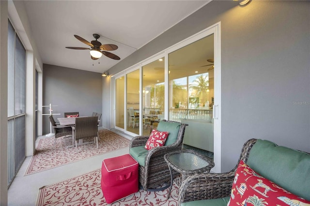 sunroom featuring ceiling fan