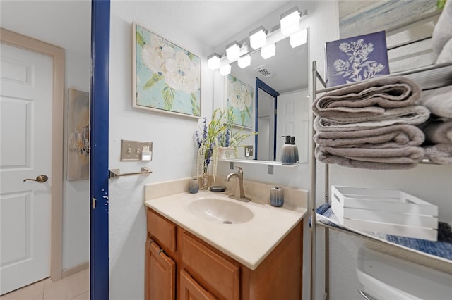 bathroom with tile patterned flooring and vanity