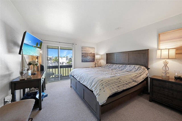 carpeted bedroom featuring access to outside