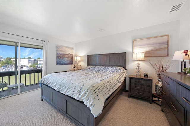 carpeted bedroom featuring access to outside