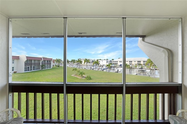 unfurnished sunroom with a water view