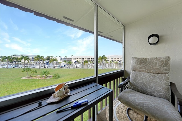 balcony featuring a water view