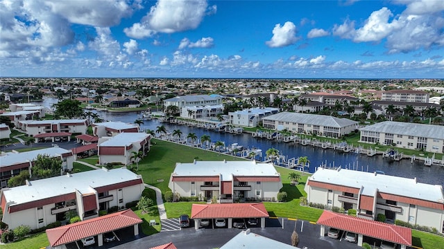 birds eye view of property with a water view