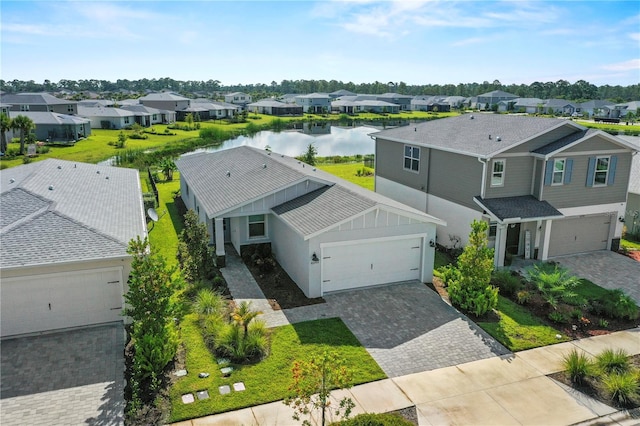 birds eye view of property with a water view