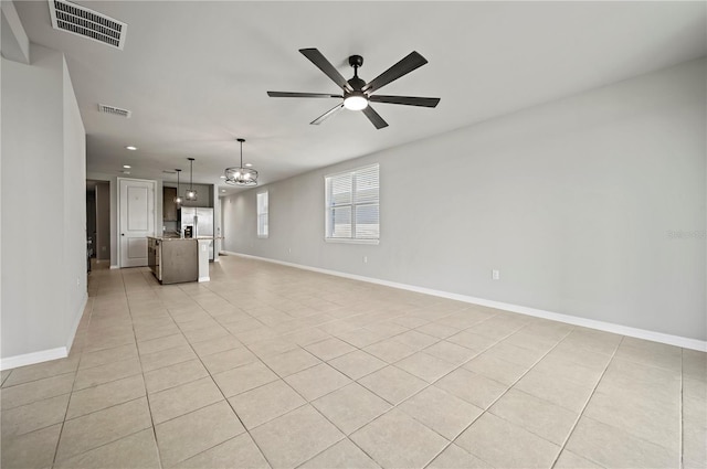 unfurnished living room with ceiling fan and light tile patterned floors