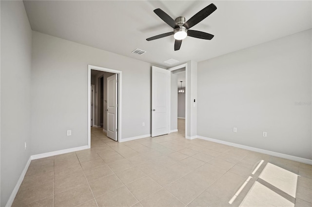 unfurnished bedroom featuring ceiling fan and light tile patterned flooring