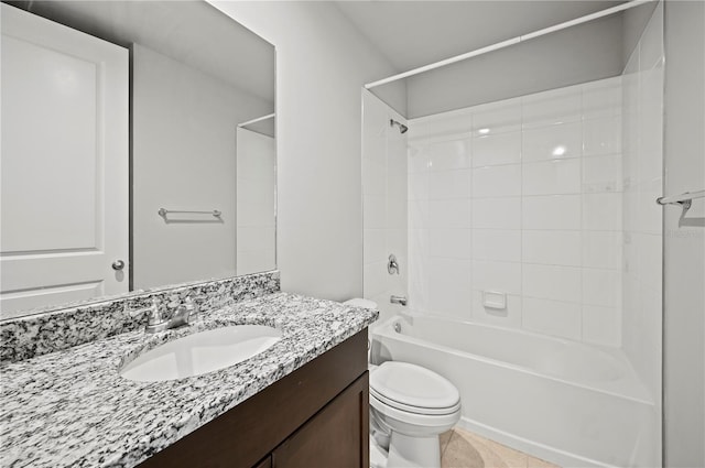 full bathroom featuring tile patterned floors, tiled shower / bath combo, vanity, and toilet