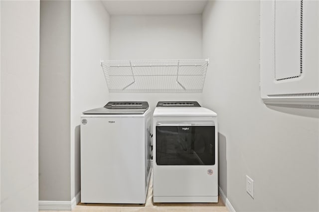 washroom with independent washer and dryer