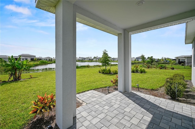 view of patio featuring a water view