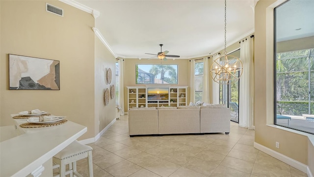 tiled living room featuring ceiling fan with notable chandelier and crown molding