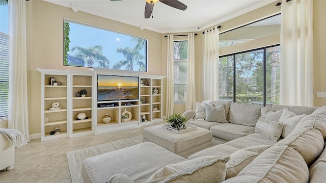 living room with ceiling fan, crown molding, light tile patterned floors, and a wealth of natural light