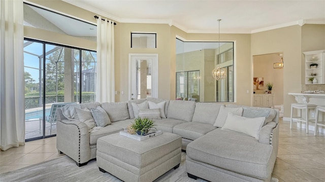 tiled living room with a notable chandelier and ornamental molding