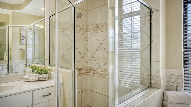 bathroom featuring vanity and an enclosed shower