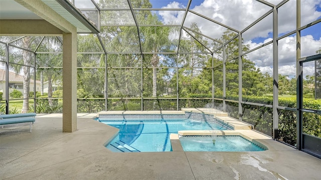 view of swimming pool featuring pool water feature, glass enclosure, an in ground hot tub, and a patio area