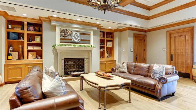 living room with crown molding, light hardwood / wood-style floors, and an inviting chandelier