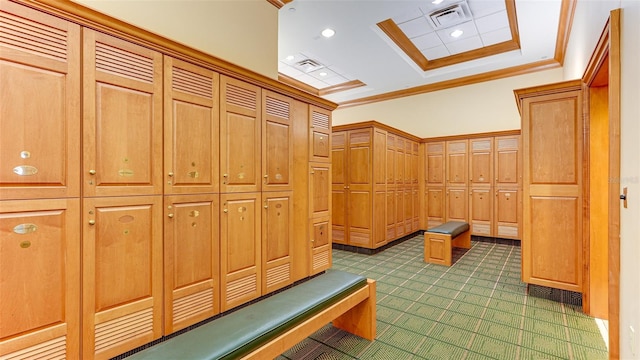 interior space with crown molding and a tray ceiling