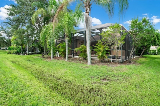 view of yard with a lanai