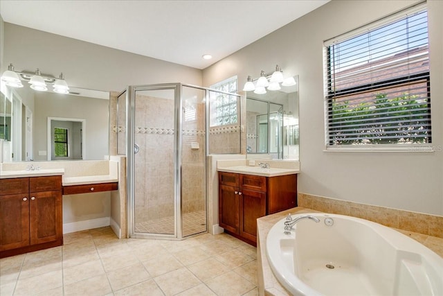 bathroom featuring vanity, separate shower and tub, and tile patterned floors