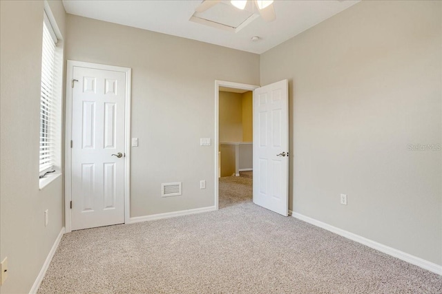 unfurnished bedroom with light carpet and ceiling fan