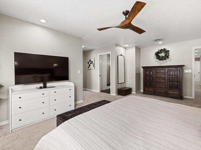 bedroom featuring ceiling fan, light carpet, and a textured ceiling