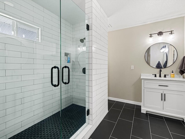 bathroom with vanity, tile patterned flooring, and a shower with door