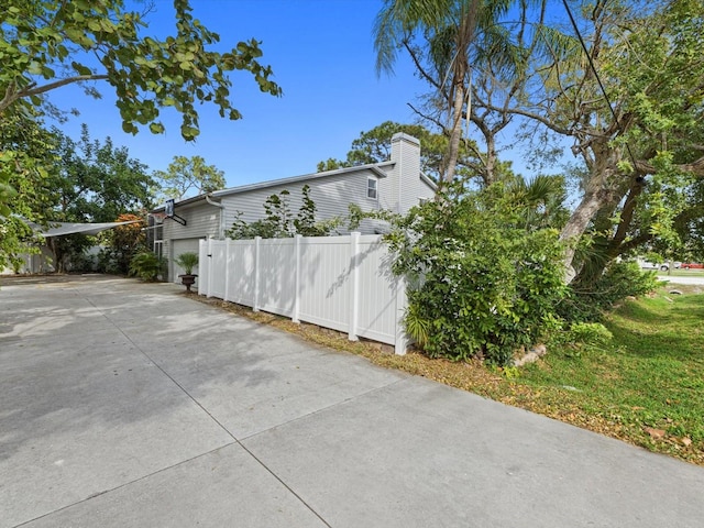 view of side of property with a lawn