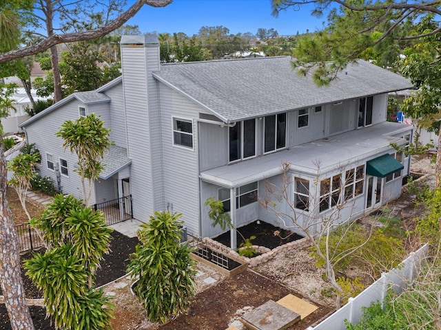 back of property featuring a sunroom