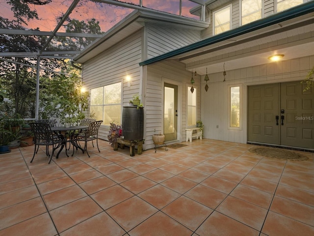 patio terrace at dusk with a lanai