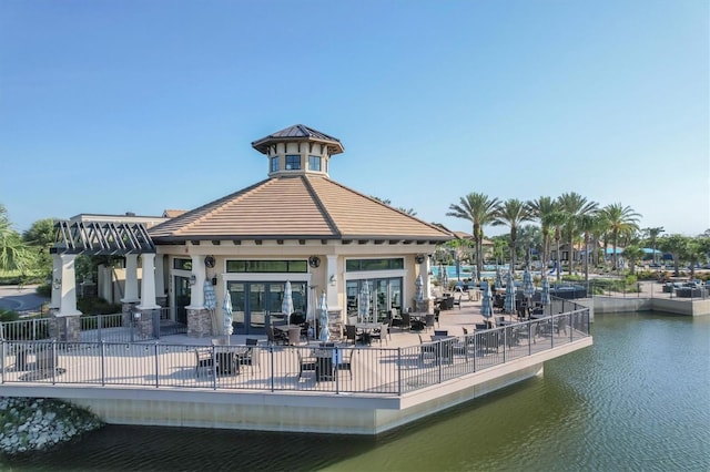 view of home's community with a patio and a water view