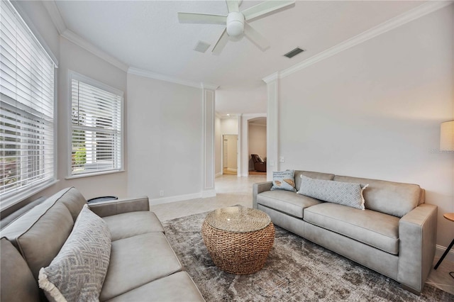 living room with ceiling fan and ornamental molding