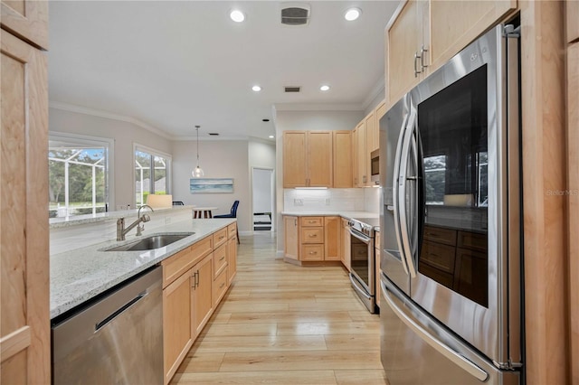 kitchen with stainless steel appliances, light brown cabinets, crown molding, light stone counters, and sink