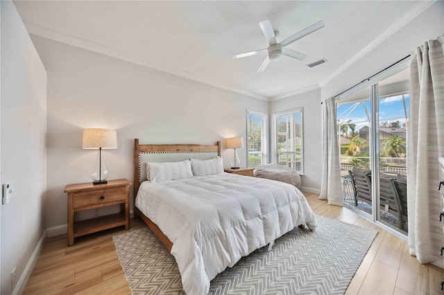 bedroom featuring a textured ceiling, access to outside, light wood-type flooring, ceiling fan, and crown molding