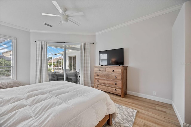 bedroom featuring light wood-type flooring, ceiling fan, access to outside, and multiple windows