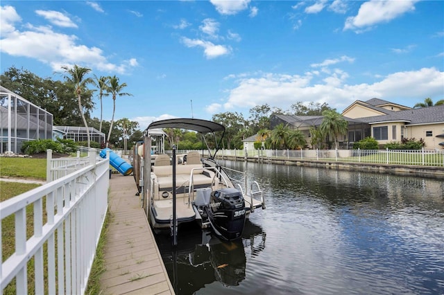 dock area featuring a lanai and a water view