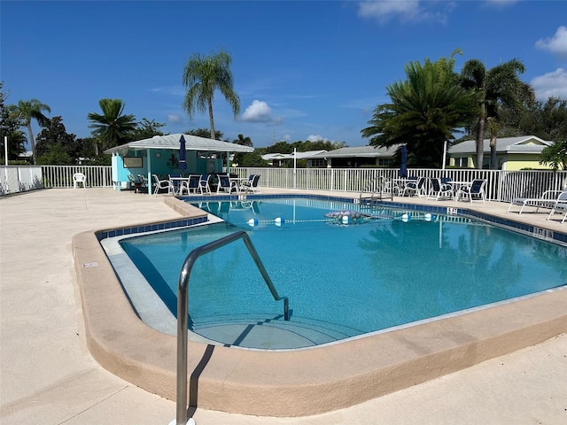 view of swimming pool with a patio area